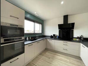 Fully equipped kitchen (dishwasher, refrigerator, oven, induction cooker with hood, etc...)