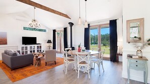 Luxe dining and lounge room with fireplace