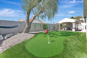 Top of the line large putting green and hammock to relax in