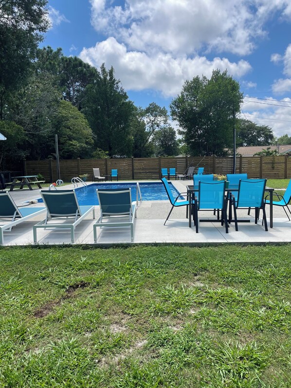 Large private salt water pool. Lounge chairs for sunbathing. Outdoor dining.