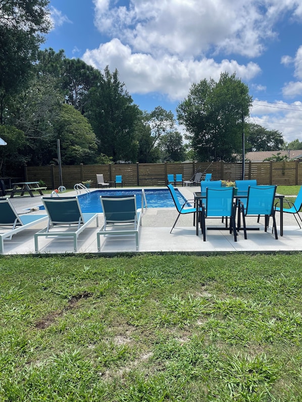 Large private salt water pool. Lounge chairs for sunbathing. Outdoor dining.