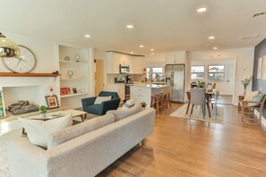 Open Concept Living Room w/Gas Fireplace and built-ins. Open to kitchen and living area.