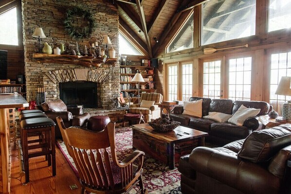 Spacious living room overlooking deck with beautiful views. 