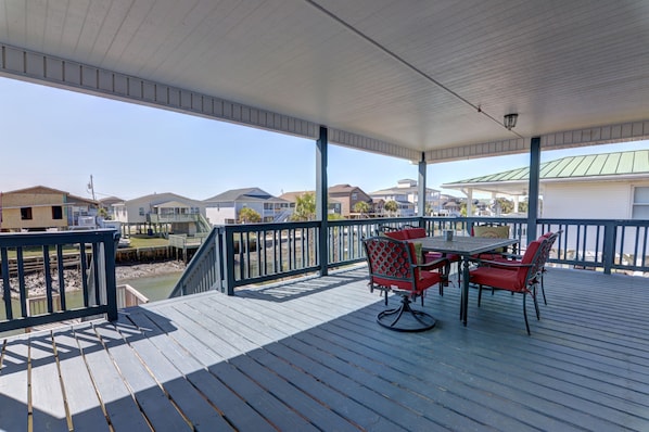 Great memories are ready to be made on this porch overlooking the channel.