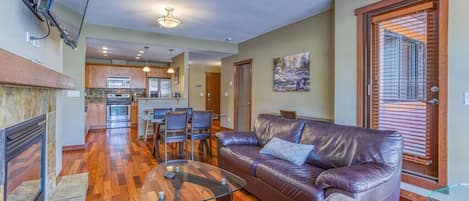 Modern Living area with television and gas fireplace