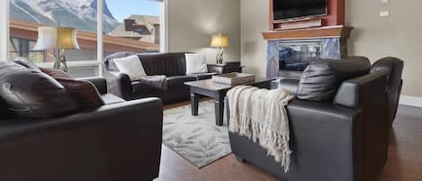 Large living area, gas fireplace, and a flat screen TV