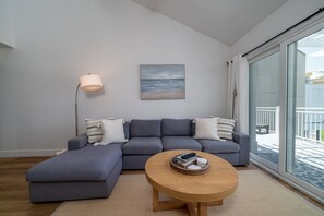 Cathedral ceilings in the great room with ceiling fans bring in the balmy ocean breezes.