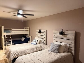 We have updated the downstairs bedroom to allow for additional sleeping spaces. 