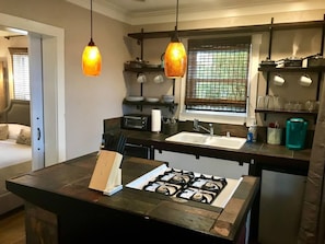 Fully stocked kitchen equipped with toaster oven, microwave and Keurig