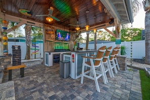 Outdoor kitchen/bar with smart TV