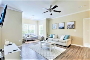 Living room with Queen sleeper sofa and YouTube TV (decor is subject to change)