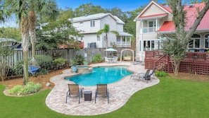 The pool and spa await guests with a large back yard!