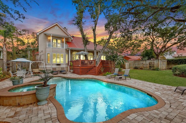 Evening view of the pool and spa at the Oak Beach Cottage