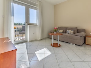 Furniture, Property, Window, Table, Interior Design, Wood, Houseplant, Living Room, Floor, Flooring