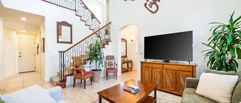 Vaulted ceilings in living area and large TV
