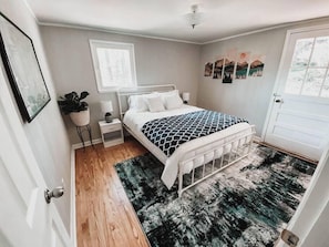 The second bedroom with a queen bed and closet for storage.