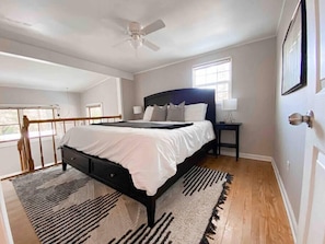 The main bedroom with a king bed and a large closet for storage.