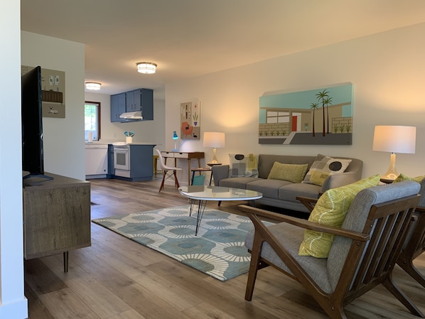 Open floor plan decorated in Mid-Century Modern style.