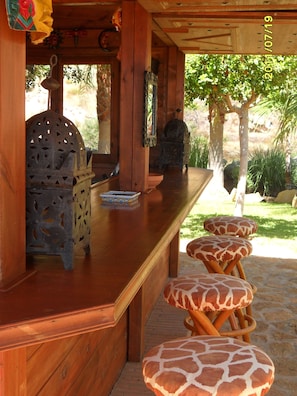 Private chiringuito in pool and palm trees garden