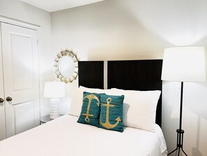 Luxurious full size bed.Wood hangers w/ darkening drapes for a satisfying sleep