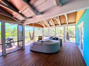 screened living area with hammock swings