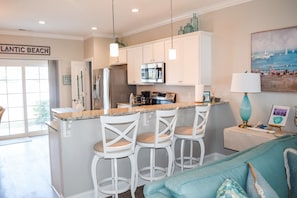 Bar stool seating and an open floor plan