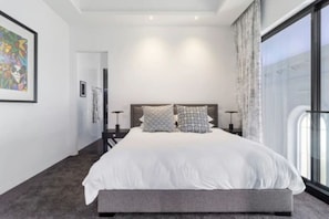 A kingsize bed awaits with quality linens
