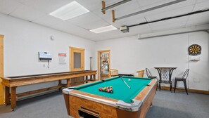 Custom shuffle board table, pool table, and darts. In the closet we have fishing gear, outdoor games, coolers, strollers, and everything else you'll need for an adventure!