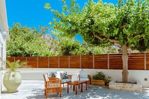 Exterior sitting area among greenery