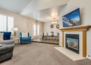 Family room with fireplace and TV