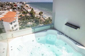 Large Private jacuzzi off living room with outdoor shower.