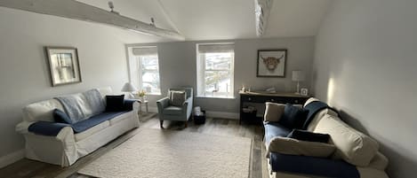 Modern living room with views of Coverdale. 