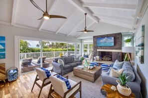 Bright, open living room faces the ocean