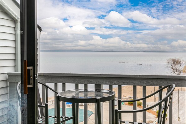 Gazing outward from within the unit, the balcony offers a captivating view of the serene beach.