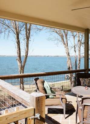 Upstairs patio seating and table overlooking the lake