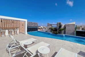 Sip, swim, and soak up the sun at our rooftop oasis pool