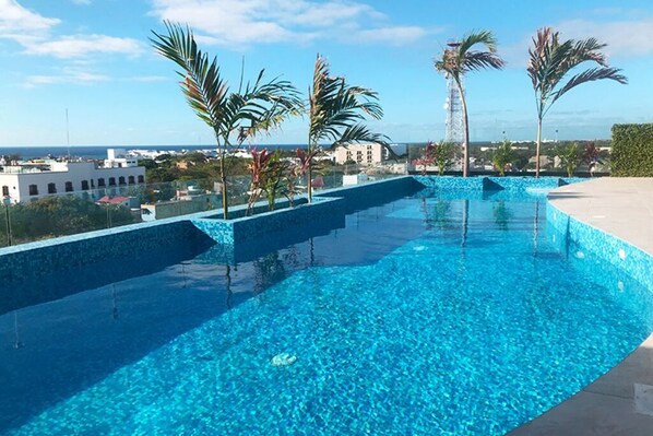 Enjoy a swim with a view at our chic rooftop pool.