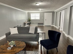 Entry area of home with desk and yoga area. 