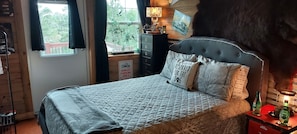 Queen bed with view of Ozarks
