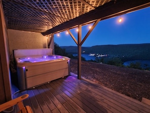 You will love the view from this hot tub! The string lights add perfect light! 