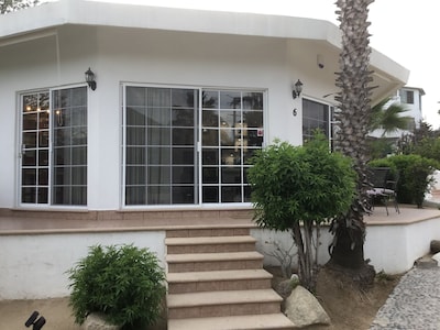 Gorgeous house in a neighbourhood surrounded by palm trees.