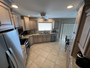 Kitchen  with wrap around views to the beach .. it’s like cooking at beachside