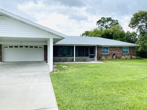 The garage, carport and driveway offer plenty of parking. 