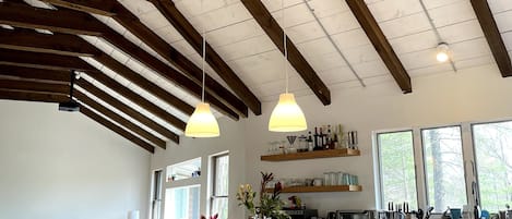 A big open living space upstairs: a view of the kitchen and living area