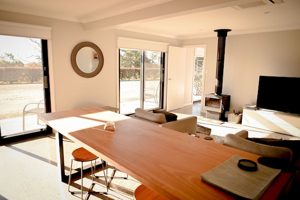 Family area with pot belly fireplace. Wood provided. 
Large glass sliding doors
