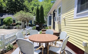 Relax and enjoy a meal on the bluestone patio with table and chairs