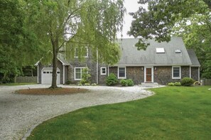 Front yard w/ circular driveway and gated entry