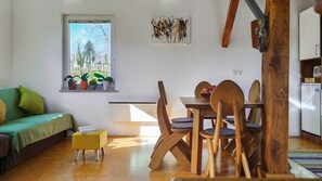 Duplex Gallery living area with dining area with traditional furnishings