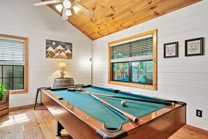 Game room with authentic whisky barrel table
