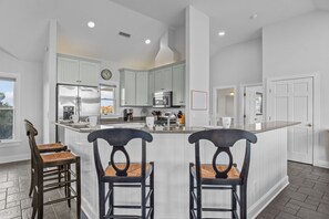 Whip up a delicious meal in the well-equipped kitchen with stainless steel appliances.